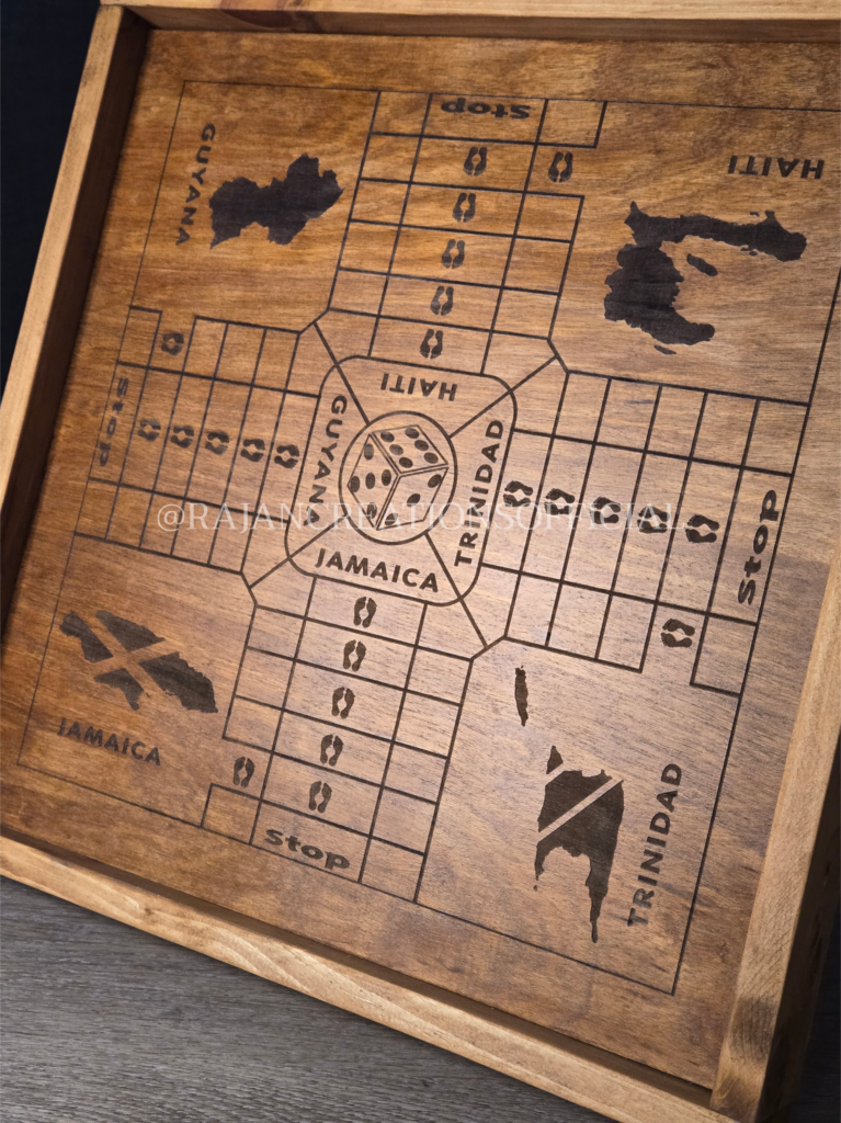 Close up image shot of engraved, wooden ludo board game with wood-stained borders and Caribbean island (e.g., Haiti, Jamaica, Trinidad & Guyana) design.