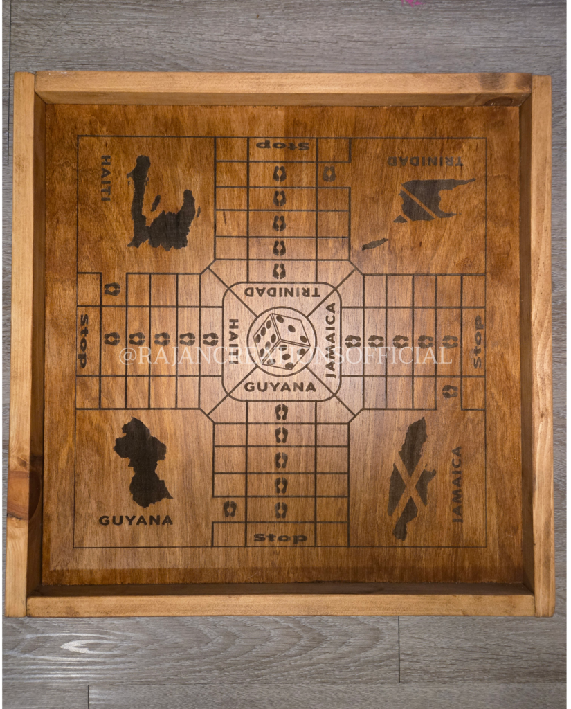 Engraved, wooden ludo board game with wood-stained borders and Caribbean island (e.g., Haiti, Jamaica, Trinidad & Guyana) design.